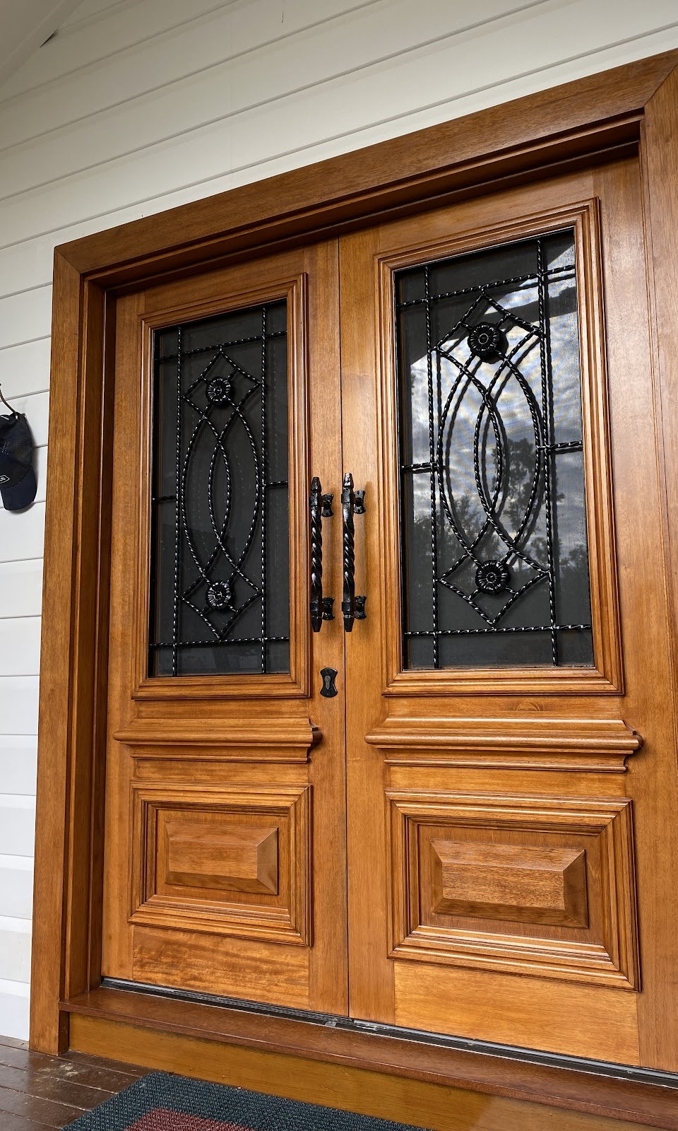 Timber double front doors with a rich, even finish