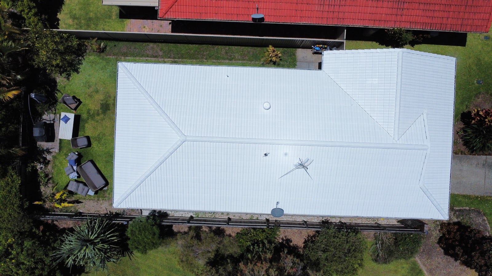 Top-down view of a bright white painted roof